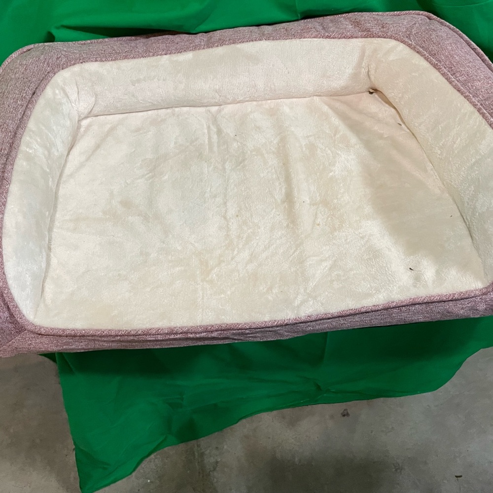 Pink pet bed. It has memory foam in the bottom. My dogs refused to use it